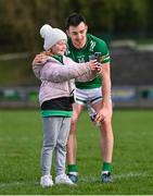 25 February 2024; Garvan Jones of Fermanagh poses for a selfie with Fermanagh supporter Mairead Maguire, age 10, from Castlebar, Mayo, afterthe Allianz Football League Division 2 match between Fermanagh and Cork at St Joseph’s Park in Ederney, Fermanagh. Photo by Ben McShane/Sportsfile