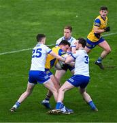 25 February 2024; Enda Smith of Roscommon in action against Michael McCarville, left, Kieran Duffy, and Killian Lavelle, right, of Monaghan during the Allianz Football League Division 1 match between Roscommon and Monaghan at Dr Hyde Park in Roscommon. Photo by Daire Brennan/Sportsfile