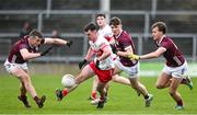 25 February 2024; Diarmuid Baker of Derry in action against John Daly, Cillian O Curraoin and Robert Finnerty of Galway during the Allianz Football League Division 1 match between Galway and Derry at Pearse Stadium in Galway. Photo by Ray Ryan/Sportsfile