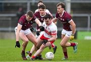25 February 2024; Diarmuid Baker of Derry in action against John Daly, Cillian O Curraoin and Robert Finnerty of Galway during the Allianz Football League Division 1 match between Galway and Derry at Pearse Stadium in Galway. Photo by Ray Ryan/Sportsfile