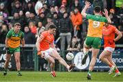 25 February 2024; Rory Grugan of Armagh dummy solos past Michael Langan of Donegal during the Allianz Football League Division 2 match between Armagh and Donegal at BOX-IT Athletic Grounds in Armagh. Photo by Brendan Moran/Sportsfile