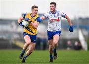 25 February 2024; Eoin McCormack of Roscommon in action against Andrew Woods of Monaghan during the Allianz Football League Division 1 match between Roscommon and Monaghan at Dr Hyde Park in Roscommon. Photo by Daire Brennan/Sportsfile