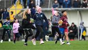 25 February 2024; Roscommon supporters run onto the field after the Allianz Football League Division 1 match between Roscommon and Monaghan at Dr Hyde Park in Roscommon. Photo by Daire Brennan/Sportsfile