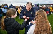 25 February 2024; Roscommon manager Davy Burke signs KitKats of Roscommon supporters Anna Garvey, aged 11, left, and Saoirse Egan, aged 10, from Ballintubber, Roscommon, after the Allianz Football League Division 1 match between Roscommon and Monaghan at Dr Hyde Park in Roscommon. Photo by Daire Brennan/Sportsfile