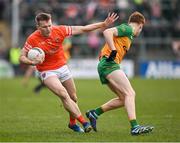 25 February 2024; Rian O'Neill of Armagh in action against Ciarán Moore of Donegal during the Allianz Football League Division 2 match between Armagh and Donegal at BOX-IT Athletic Grounds in Armagh. Photo by Brendan Moran/Sportsfile