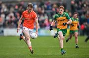 25 February 2024; Rian O'Neill of Armagh in action against Ciarán Moore of Donegal during the Allianz Football League Division 2 match between Armagh and Donegal at BOX-IT Athletic Grounds in Armagh. Photo by Brendan Moran/Sportsfile