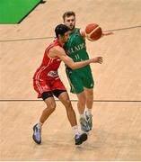 25 February 2024; Sean Flood of Ireland in action against Selim Fofana of Switzerland during the FIBA Basketball World Cup 2027 European Pre-Qualifiers first round match between Ireland and Switzerland at the National Basketball Arena in Tallaght, Dublin. Photo by David Fitzgerald/Sportsfile