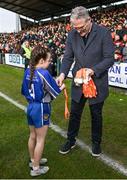 25 February 2024; Uachtarán Chumann Lúthchleas Gael Jarlath Burns makes his frst presentation as president of the GAA to Caitln McKee of Our Lady's and St Mochua's PS, Derrynoose, Armagh, during half time in the Allianz Football League Division 2 match between Armagh and Donegal at BOX-IT Athletic Grounds in Armagh. Photo by Brendan Moran/Sportsfile