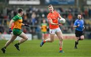 25 February 2024; Rian O'Neill of Armagh in action against Jamie Brennan of Donegal during the Allianz Football League Division 2 match between Armagh and Donegal at BOX-IT Athletic Grounds in Armagh. Photo by Brendan Moran/Sportsfile