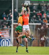 25 February 2024; Andrew Murnin of Armagh catchs a kickout ahead of Hugh McFadden of Donegal during the Allianz Football League Division 2 match between Armagh and Donegal at BOX-IT Athletic Grounds in Armagh. Photo by Brendan Moran/Sportsfile