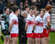 25 February 2024; Derry manager Mickey Harte with his players stand for the National Anthem at the Allianz Football League Division 1 match between Galway and Derry at Pearse Stadium in Galway. Photo by Ray Ryan/Sportsfile