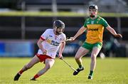 24 February 2024; Bryan McGurk of Tyrone and Conor Gartland of Donegal during the Allianz Hurling League Division 2 Group B match between Tyrone and Donegal at O'Neills Healy Park in Omagh, Tyrone. Photo by Ben McShane/Sportsfile