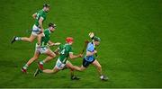 24 February 2024; James Madden of Dublin is pursued by Limerick players Barry Nash, 4, Gearóid Hegarty and Tom Morrissey, left, during the Allianz Hurling League Division 1 Group B match between Dublin and Limerick at Croke Park in Dublin. Photo by Ray McManus/Sportsfile