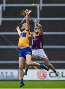 25 February 2024; Peter Duggan of Clare in action against Shane Reck of Wexford during the Allianz Hurling League Division 1 Group A match between Wexford and Clare at Chadwicks Wexford Park in Wexford. Photo by Seb Daly/Sportsfile