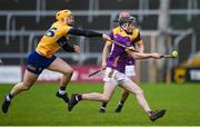 25 February 2024; Corey Byrne Dunbar of Wexford in action against Shane Meehan of Clare during the Allianz Hurling League Division 1 Group A match between Wexford and Clare at Chadwicks Wexford Park in Wexford. Photo by Seb Daly/Sportsfile
