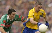 18 July 2004; Jonathon Dunning, Roscommon, in action against Conor Moran, Mayo. Bank of Ireland Connacht Senior Football Championship Final, Mayo v Roscommon, McHale Park, Castlebar, Co. Mayo. Picture credit; Pat Murphy / SPORTSFILE