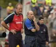 18 July 2004; Tommy Carr, Roscommon manager, and Mayo manager John Maughan, left, watch on during the final moments of the game. Bank of Ireland Connacht Senior Football Championship Final, Mayo v Roscommon, McHale Park, Castlebar, Co. Mayo. Picture credit; Pat Murphy / SPORTSFILE
