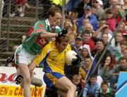 18 July 2004; David Casey, Roscommon, in action against James Nallen, Mayo. Bank of Ireland Connacht Senior Football Championship Final, Mayo v Roscommon, McHale Park, Castlebar, Co. Mayo. Picture credit; Pat Murphy / SPORTSFILE
