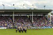 18 July 2004; The Mayo and Roscommon teams walk in front of their supporters during the pre-match parade in McHale Park. Bank of Ireland Connacht Senior Football Championship Final, Mayo v Roscommon, McHale Park, Castlebar, Co. Mayo. Picture credit; Damien Eagers / SPORTSFILE