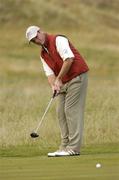 23 July 2004; David Higgins watches his putt on the 8th green during the second round. Nissan Irish Open Golf Championship, County Louth Golf Club, Baltray, Co. Louth. Picture credit; Matt Browne / SPORTSFILE