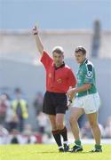 18 July 2004; Limerick's Jason Stokes is shown a yellow card by referee Mick Curley. Bank of Ireland Munster Senior Football Championship Final Replay, Kerry v Limerick, Fitzgerald Stadium, Killarney, Co. Kerry. Picture credit; Brendan Moran / SPORTSFILE