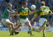 18 July 2004; Dara O'Cinneide, Kerry, supported by team-mate Mike Frank Russell (15), in action against Johnny McCarthy, Limerick. Bank of Ireland Munster Senior Football Championship Final Replay, Kerry v Limerick, Fitzgerald Stadium, Killarney, Co. Kerry. Picture credit; Brendan Moran / SPORTSFILE