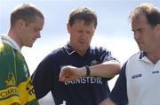 18 July 2004; Kerry manager Jack O'Connor checks his watch in the company of substitute Declan Quill, left, and fitness trainer Pat Flanagan. Bank of Ireland Munster Senior Football Championship Final Replay, Kerry v Limerick, Fitzgerald Stadium, Killarney, Co. Kerry. Picture credit; Brendan Moran / SPORTSFILE