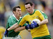 24 July 2004; Brendan Devenney, Donegal, in action against Raymond Johnson, Fermanagh. Bank of Ireland Senior Football Championship Qualifier, Round 4, Fermanagh v Donegal, Tighernach's Park, Clones. Co. Monaghan. Picture credit; Damien Eagers / SPORTSFILE