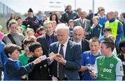 13 May 2013; Republic of Ireland manager Giovanni Trapattoni signs autographs on a visit to The Goal for Peace Programme. This is a novel programme run only in Leitrim bringing together children from Catholic and Protestant backgrounds from 10 schools in Leitrim and Fermanagh through the medium of soccer. This programme has been so successful that a follow up programme is now starting with a further 10 schools participating in the Goal to Friendship programme. These programmes also receive funding through the International Fund for Ireland (IFI) and Peace III Partnership. The Community Soccer Programme also works to build the capacity of local clubs who have been instrumental in coach education, bringing local children into the club scene for a variety of programmes including the Football for All and Summer Soccer Schools. Leitrim Gaels Community Pitch, Leitrim Village, Co. Leitrim. Picture credit: Stephen McCarthy / SPORTSFILE