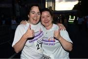 10 September 2013; Ann O'Donnell, left, from Cavan, and Sinead Donnelly, from Dunshaughlin, Co. Meath, running for Tech Group Europe in the Grant Thornton 5k Corporate Team Challenge 2013. Dublin Docklands, Dublin. Photo by Sportsfile