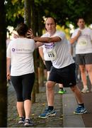 10 September 2013; Noel Delaney, from Team AMG, warms up before the Grant Thornton 5k Corporate Team Challenge 2013. Dublin Docklands, Dublin. Photo by Sportsfile