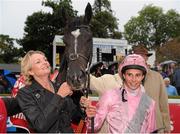 7 September 2013; Owner Lady Madeleine Webber with the Fuge and jockey William Buick in the winners enclosure after winning the Red Mills Irish Champion Stakes. Leopardstown Racecourse, Leopardstown, Co. Dublin. Picture credit: Barry Cregg / SPORTSFILE