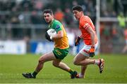 25 February 2024; Ryan McHugh of Donegal in action against Rory Grugan of Armagh during the Allianz Football League Division 2 match between Armagh and Donegal at BOX-IT Athletic Grounds in Armagh. Photo by Brendan Moran/Sportsfile