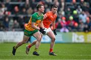 25 February 2024; Mark Curran of Donegal in action against Greg McCabe of Armagh during the Allianz Football League Division 2 match between Armagh and Donegal at BOX-IT Athletic Grounds in Armagh. Photo by Brendan Moran/Sportsfile