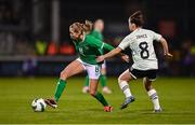 27 February 2024; Ruesha Littlejohn of Republic of Ireland is tackled by Angharad James of Wales during the international women's friendly match between Republic of Ireland and Wales at Tallaght Stadium in Dublin. Photo by Tyler Miller/Sportsfile