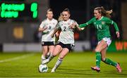 27 February 2024; Lily Woodham of Wales in action against Heather Payne of Republic of Ireland during the international women's friendly match between Republic of Ireland and Wales at Tallaght Stadium in Dublin. Photo by Tyler Miller/Sportsfile