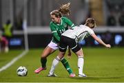 27 February 2024; Heather Payne of Republic of Ireland is tackled by Lily Woodham of Wales during the international women's friendly match between Republic of Ireland and Wales at Tallaght Stadium in Dublin. Photo by David Fitzgerald/Sportsfile