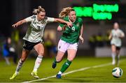 27 February 2024; Amber Barrett of Republic of Ireland in action against Gemma Evans of Wales during the international women's friendly match between Republic of Ireland and Wales at Tallaght Stadium in Dublin. Photo by Tyler Miller/Sportsfile