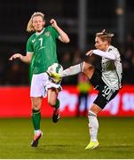 27 February 2024; Diane Caldwell of Republic of Ireland in action against Jess Fishlock of Wales during the international women's friendly match between Republic of Ireland and Wales at Tallaght Stadium in Dublin. Photo by Tyler Miller/Sportsfile