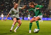 27 February 2024; Kyra Carusa of Republic of Ireland in action against Josie Green of Wales during the international women's friendly match between Republic of Ireland and Wales at Tallaght Stadium in Dublin. Photo by Tyler Miller/Sportsfile