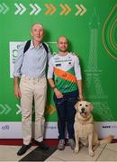 28 February 2024; Irish para-triathlete Donnacha McCarthy, centre, with his guide dog Aero, and his former coach Dave Tilley at The Helix in DCU, Dublin, for Paralympics Ireland's '6 Months to Go' event ahead of the Paralympic Games 2024 in Paris, France. Photo by Seb Daly/Sportsfile