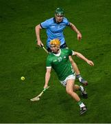 24 February 2024; Adam English of Limerick in action against James Madden of Dublin during the Allianz Hurling League Division 1 Group B match between Dublin and Limerick at Croke Park in Dublin. Photo by Ray McManus/Sportsfile