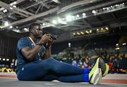 29 February 2024; Israel Olatunde of Ireland takes photographs during the official team training session ahead of the World Indoor Athletics Championships 2024 at Emirates Arena in Glasgow, Scotland. Photo by Sam Barnes/Sportsfile