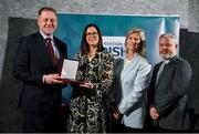 29 February 2024; Fidelma Sheridan of Cumman Na mBunscol County Cavan, second left, receives her award from Minister of State for Sport and Physical Education Thomas Byrne TD, left, Federation of Irish Sport chair Clare McGrath, and Louth Sports Partnership and Louth County Council head of sport, Federation of Irish Sport board member and member of the Awards Judging Panel Graham Russell, right, during the Federation of Irish Sport Volunteers in Sport Awards at The Crowne Plaza Hotel in Blanchardstown, Dublin. Photo by Seb Daly/Sportsfile
