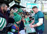29 February 2024; Tadhg Furlong signs autographs for supporters after an Ireland rugby training session at the Aviva Stadium in Dublin. Photo by Matt Browne/Sportsfile