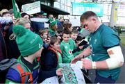 29 February 2024; Tadhg Furlong signs autographs for supporters after an Ireland rugby training session at the Aviva Stadium in Dublin. Photo by Matt Browne/Sportsfile
