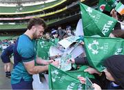 29 February 2024; Caelan Doris signs autographs for young supporters after an Ireland rugby training session at the Aviva Stadium in Dublin. Photo by Matt Browne/Sportsfile