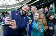 29 February 2024; Ireland head coach Andy Farrell takes a selfie with Kelsey O'Reilly, age 12, from Killaloe, Co Clare, after Ireland rugby training session at the Aviva Stadium in Dublin. Photo by Matt Browne/Sportsfile