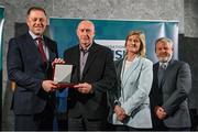 29 February 2024; Arnold Morgan of Banbridge Table Tennis Club, Down, second left, receives his award from Minister of State for Sport and Physical Education Thomas Byrne TD, left, Federation of Irish Sport chair Clare McGrath, second right, and Louth Sports Partnership and Louth County Council head of sport, Federation of Irish Sport board member and member of the Awards Judging Panel Graham Russell, during the Federation of Irish Sport Volunteers in Sport Awards at The Crowne Plaza Hotel in Blanchardstown, Dublin. Photo by Seb Daly/Sportsfile