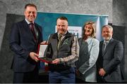 29 February 2024; Damien Devine of Deele Community Anglers, Donegal, second left, receives his award from Minister of State for Sport and Physical Education Thomas Byrne TD, left, Federation of Irish Sport chair Clare McGrath, second right, and Louth Sports Partnership and Louth County Council head of sport, Federation of Irish Sport board member and member of the Awards Judging Panel Graham Russell, during the Federation of Irish Sport Volunteers in Sport Awards at The Crowne Plaza Hotel in Blanchardstown, Dublin. Photo by Seb Daly/Sportsfile